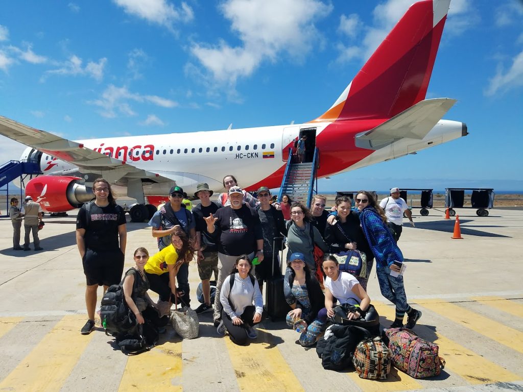 Picture of my tour group in front of the airplane we took to the Galapagos islands. 