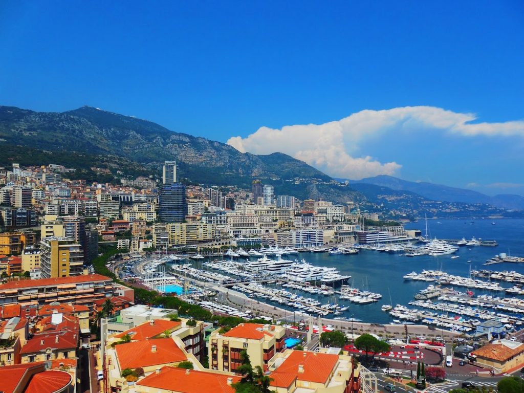 A picture of Port Hercules in Monaco showing all of the yachts and buildings. It is a must-see during your day trip to Monaco. 