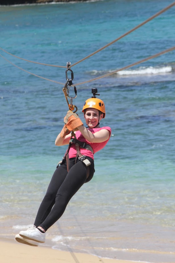 Me ziplining during the Zip & Zoom cruise excursion