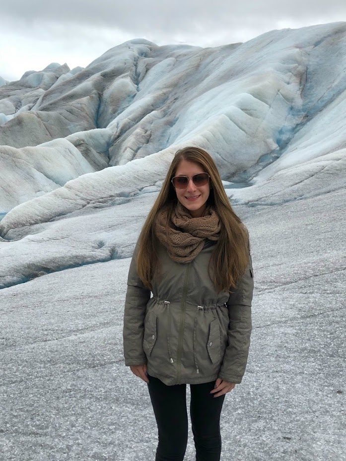 Picture of me wearing sunglasses while visiting a glacier, which is an important Alaska cruise tip because the sun bounces off the ice. 