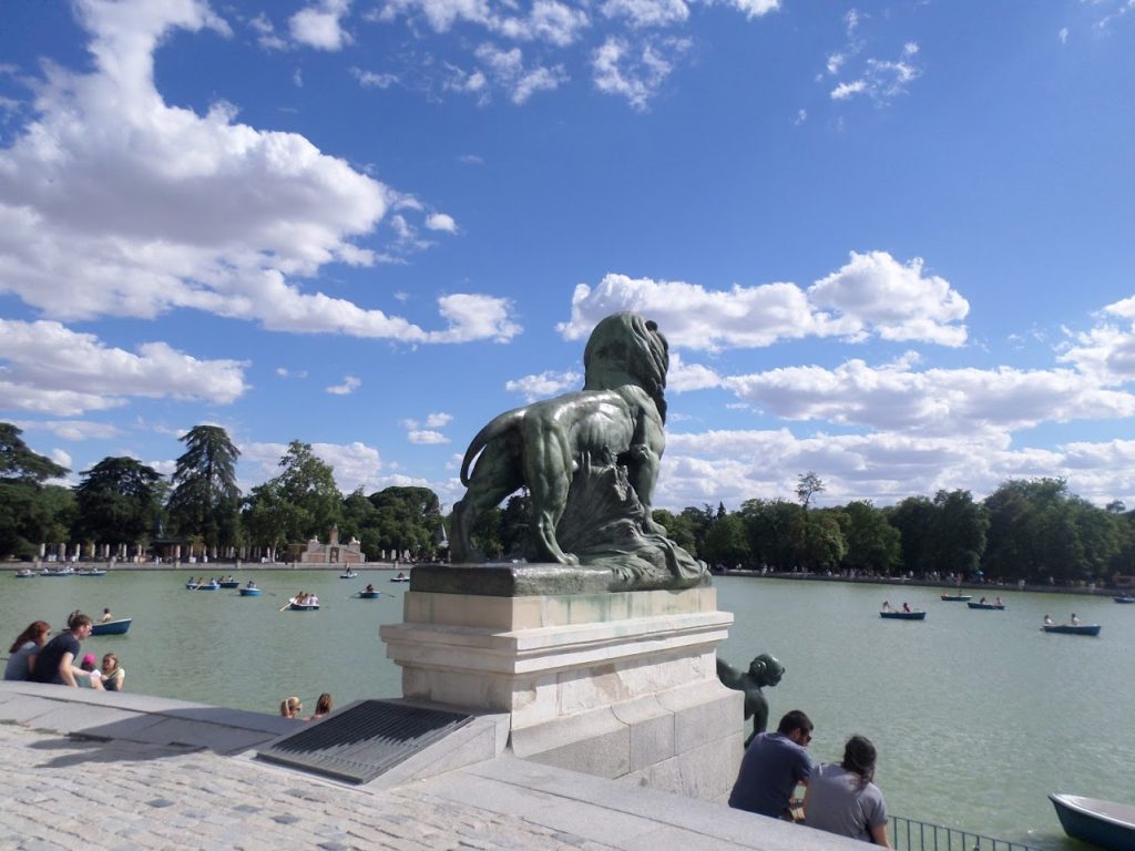 Picture of a sculpture of a lion in El Retiro Park, which is located in Madrid.