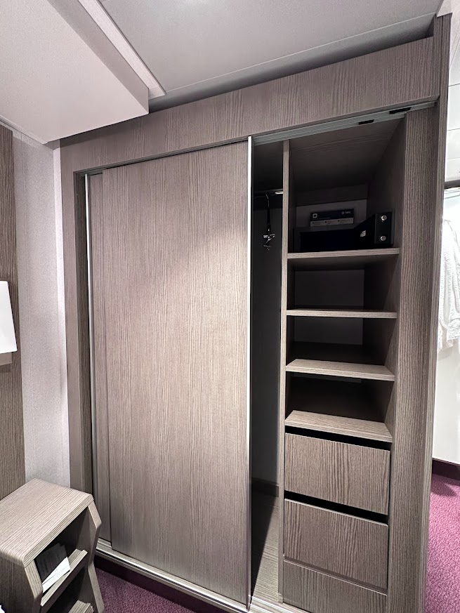 Shelves and drawers in the closet of the MSC Seaside Deluxe Ocean View Cabin