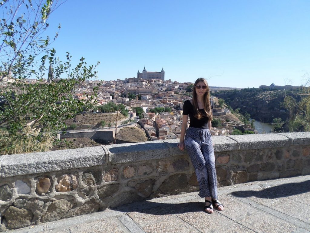 Picture of me standing in front of a viewpoint of Toledo.