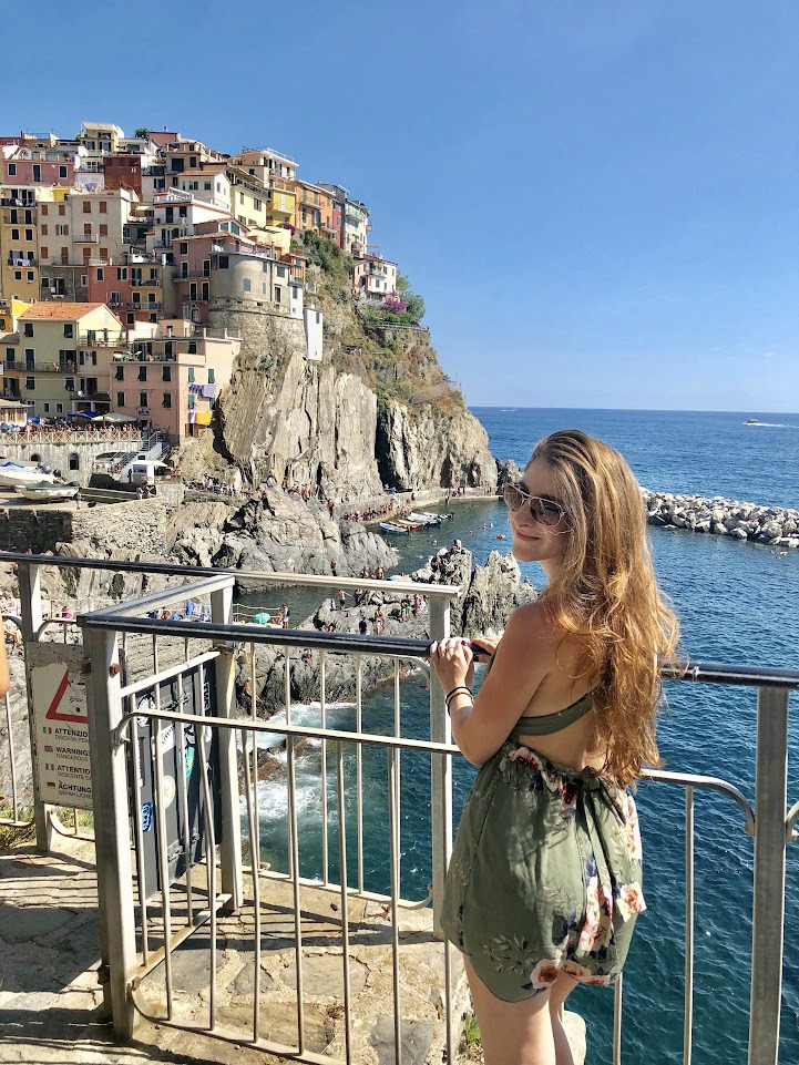 Picture of me in Cinque Terre in Italy, which is a popular summer babymoon destination. 