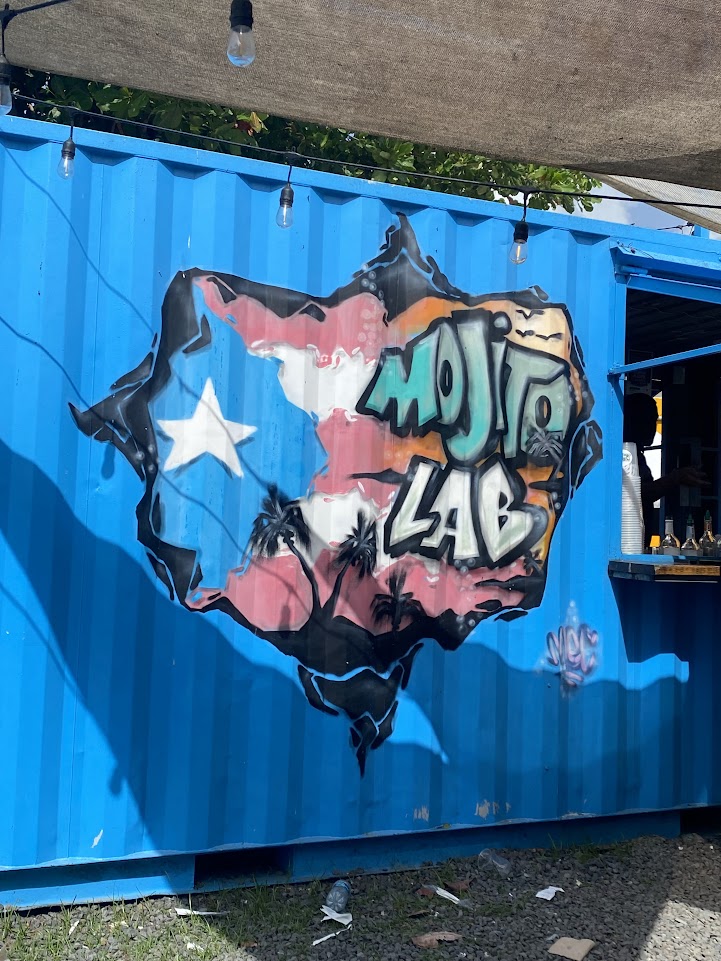 A picture of a mural painted on the side of a bar called "Mojito Lab," which is located on Luquillo beach.